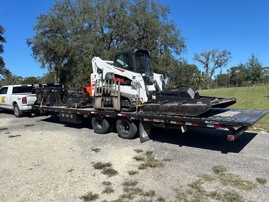 Klaus Excavation equipment loaded on a trailer